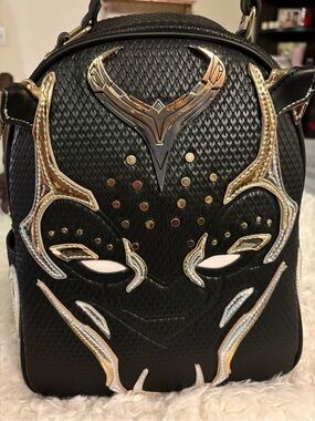Black Men's Embossed Leather Backpack with Gold Accents